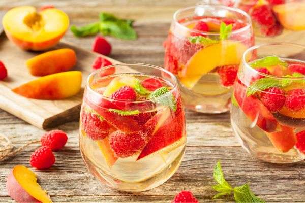 raspberry peach sangria with prosecco cocktails